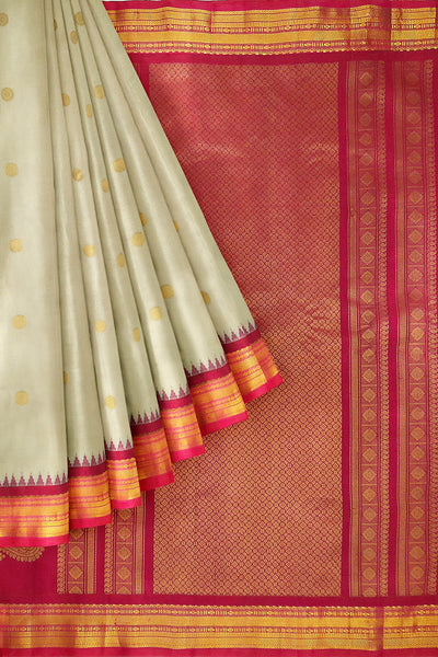 Handwoven Gadwal pure silk saree in cream with  gold buttis.