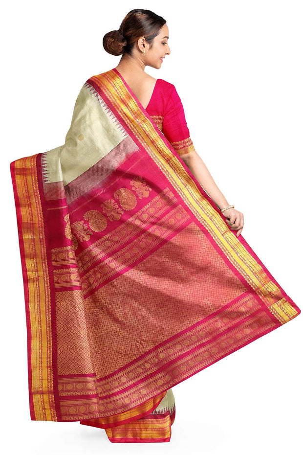 Handwoven Gadwal pure silk saree in cream with  gold buttis.