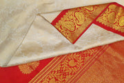 Handwoven Gadwal silk brocade saree in off white with floral motifs on the body
