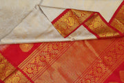 Handwoven Gadwal silk brocade saree in off white with floral motifs on the body