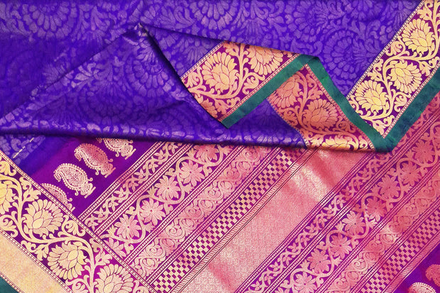 Handloom Gadwal silk brocade saree in violet  with floral motifs on the body