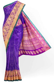 Handloom Gadwal silk brocade saree in violet  with floral motifs on the body