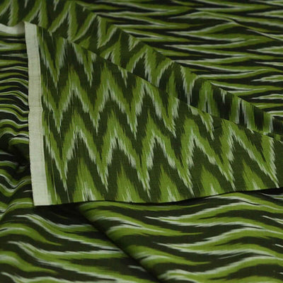 Handwoven ikat  pure cotton fabric in green in zig zag pattern