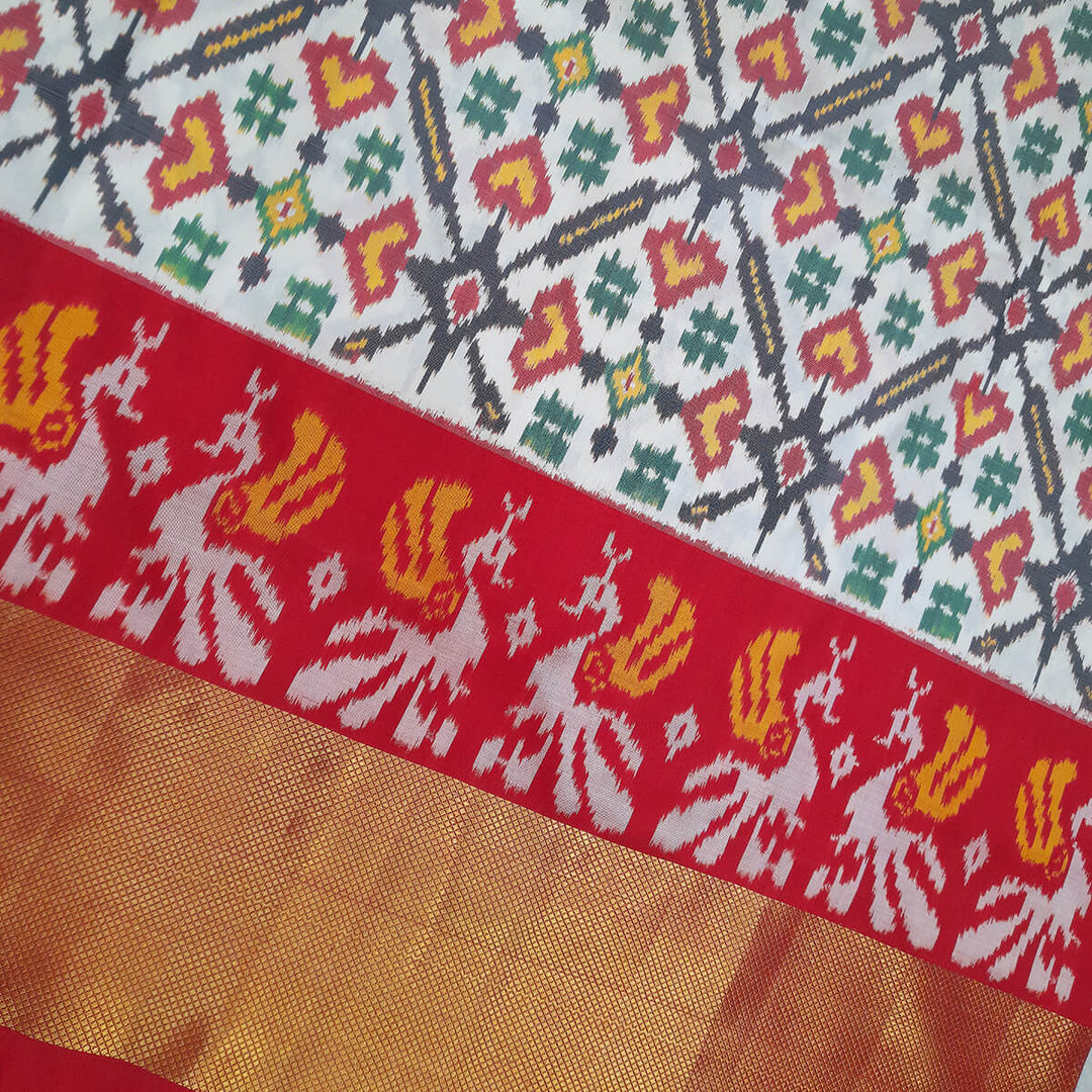 Handwoven Ikat pure silk unstitched lehenga material in off white  in pan bhat pattern