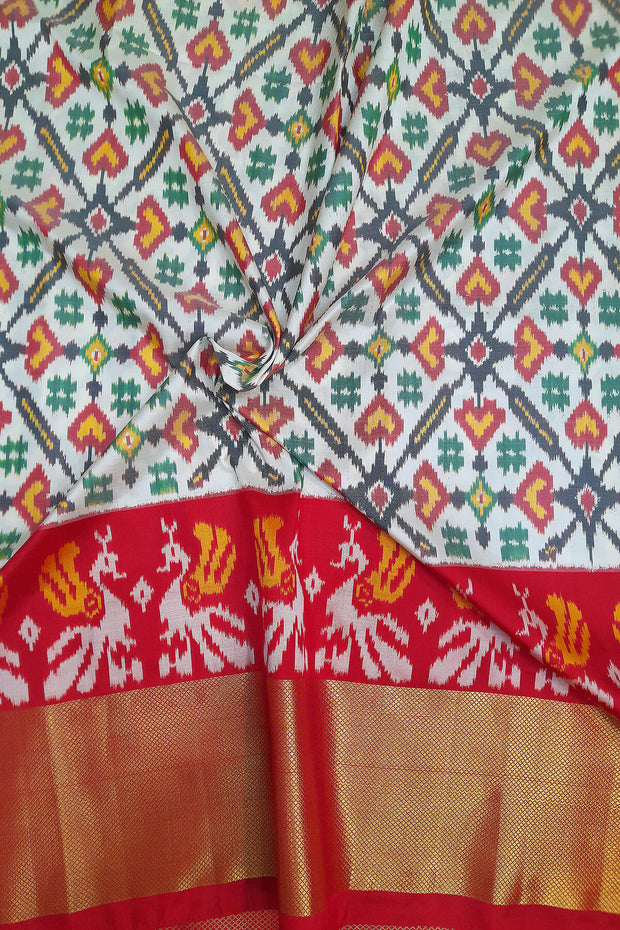 Handwoven Ikat pure silk unstitched lehenga material in off white  in pan bhat pattern