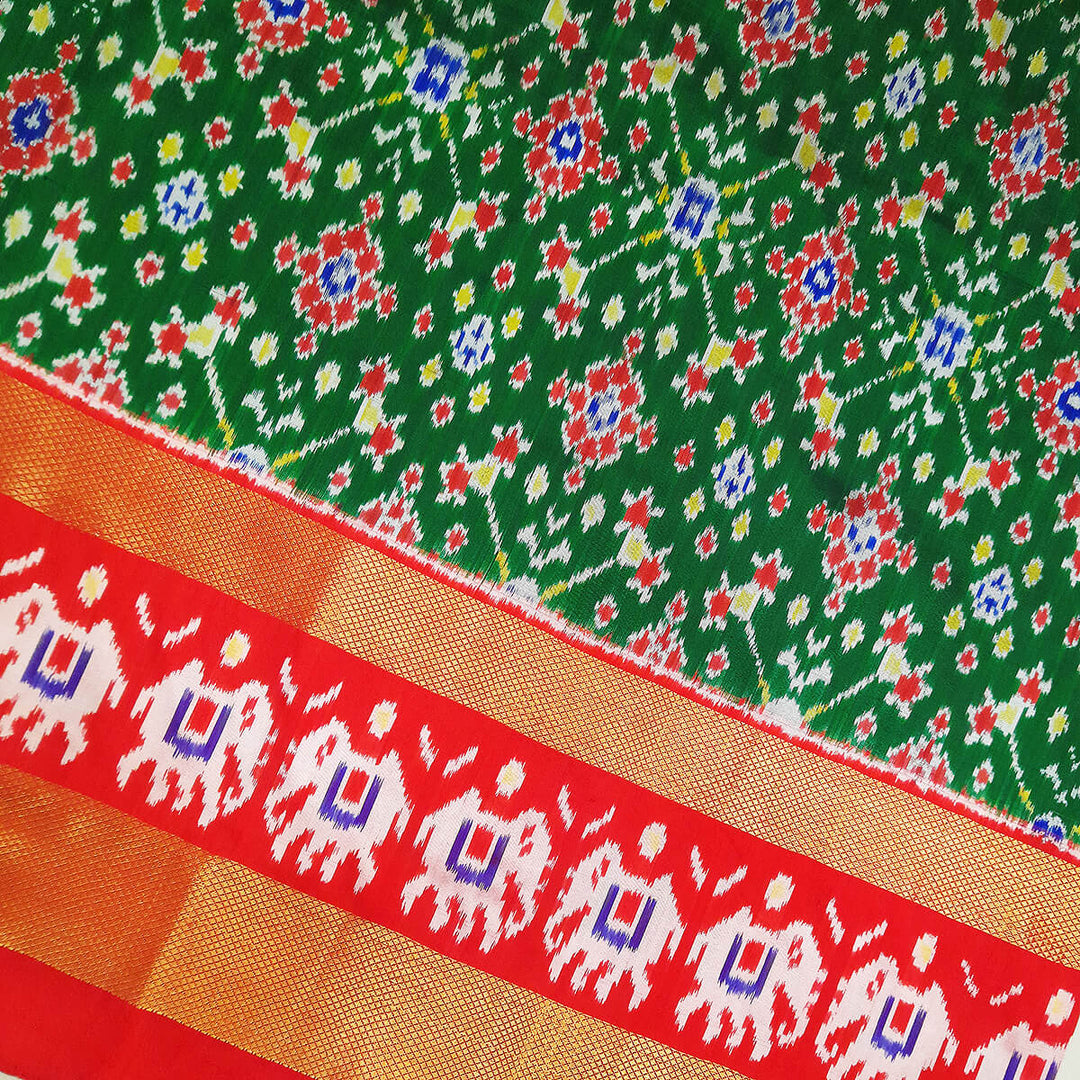 Handwoven Ikat pure silk unstitched lehenga material in bottle green  in navratan pattern