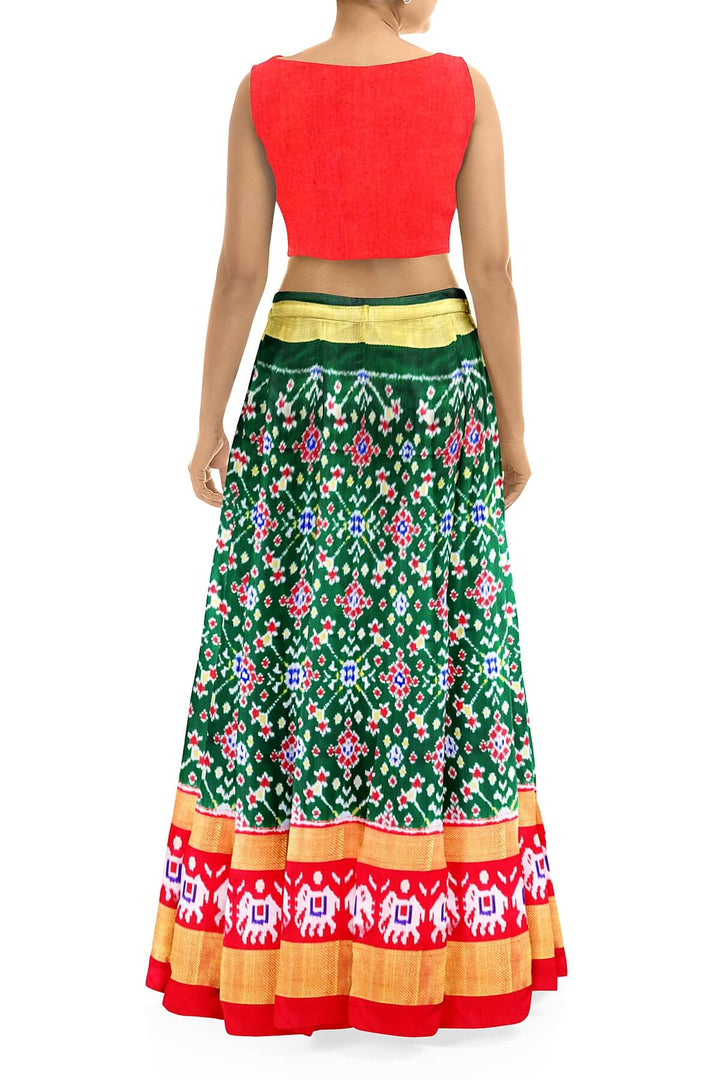 Handwoven Ikat pure silk unstitched lehenga material in bottle green  in navratan pattern