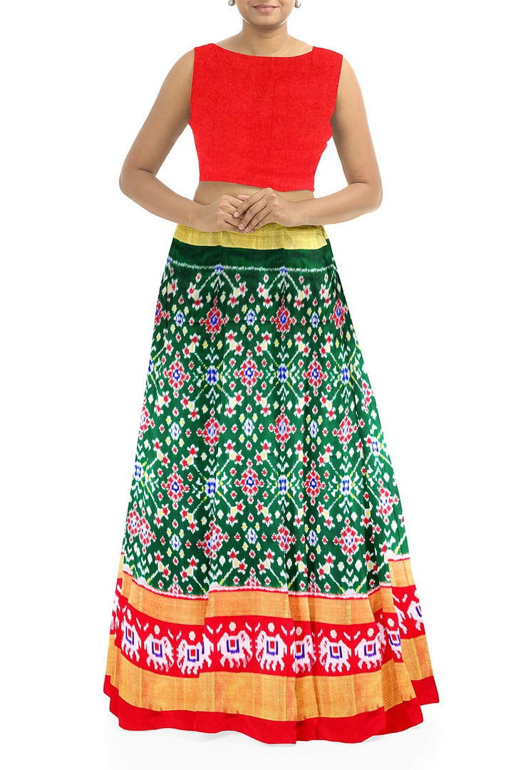 Handwoven Ikat pure silk unstitched lehenga material in bottle green  in navratan pattern