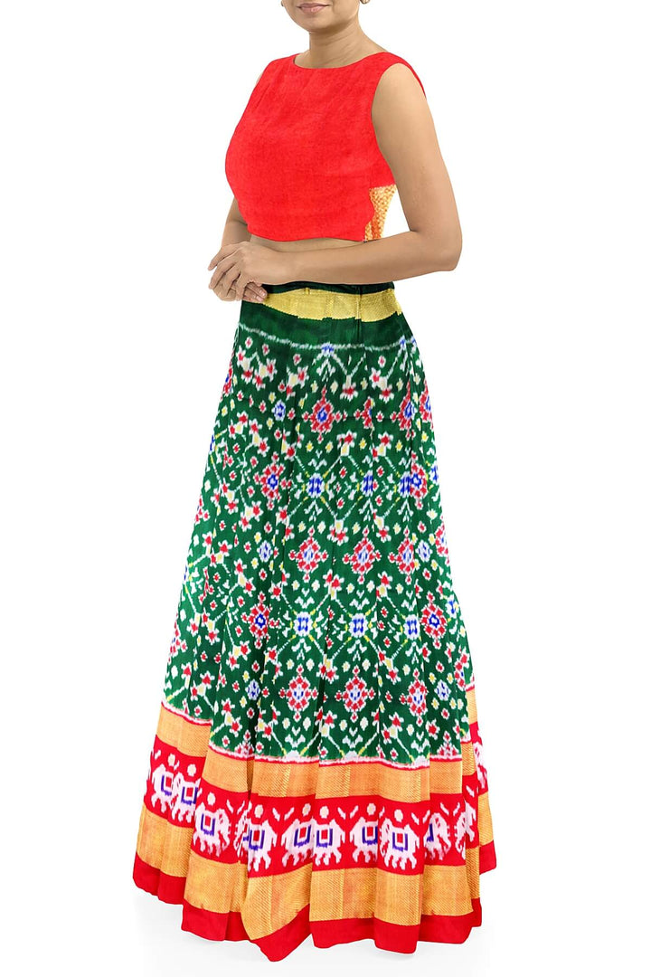 Handwoven Ikat pure silk unstitched lehenga material in bottle green  in navratan pattern