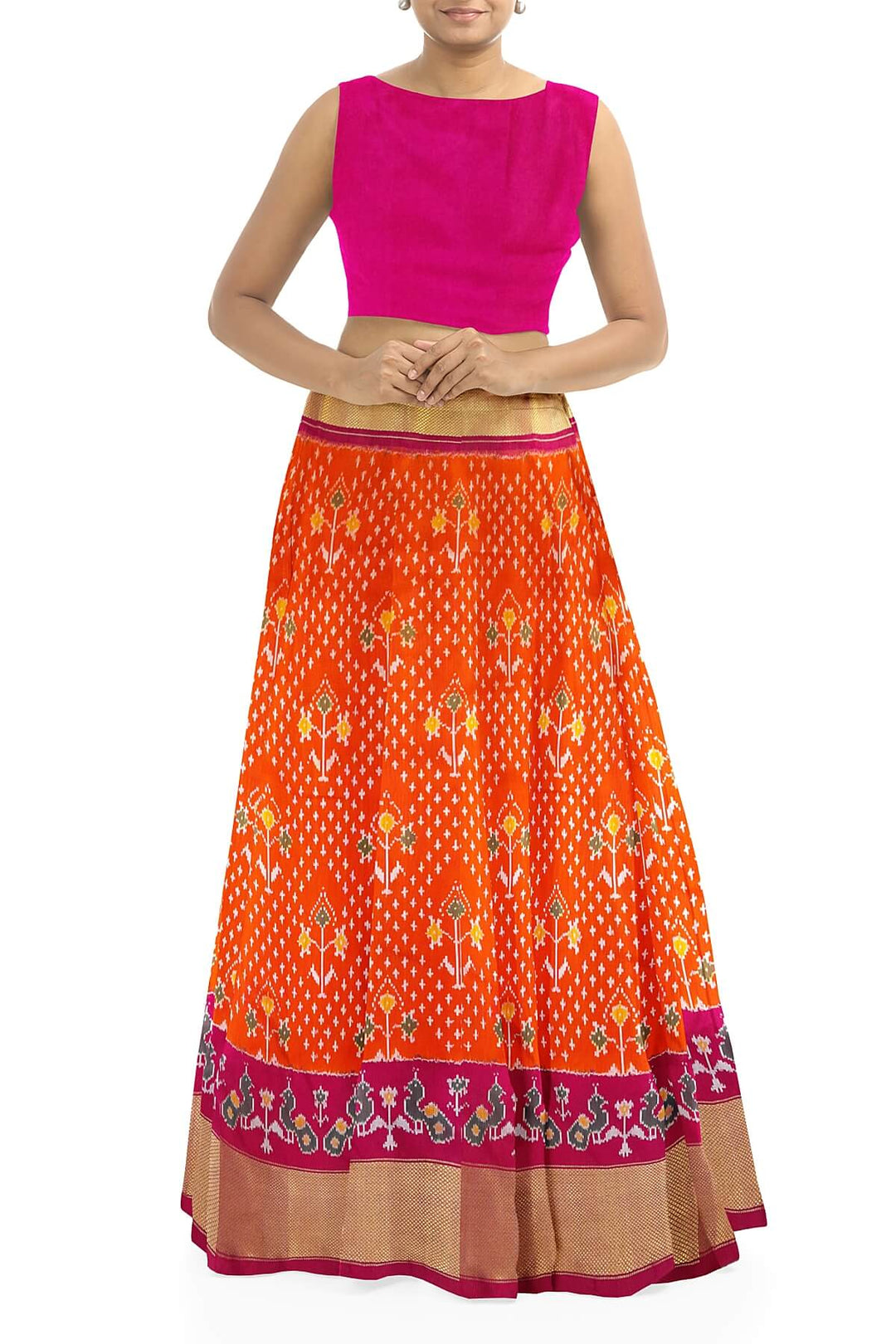Handwoven Ikat pure silk unstitched lehenga material in orange  with plant motifs.