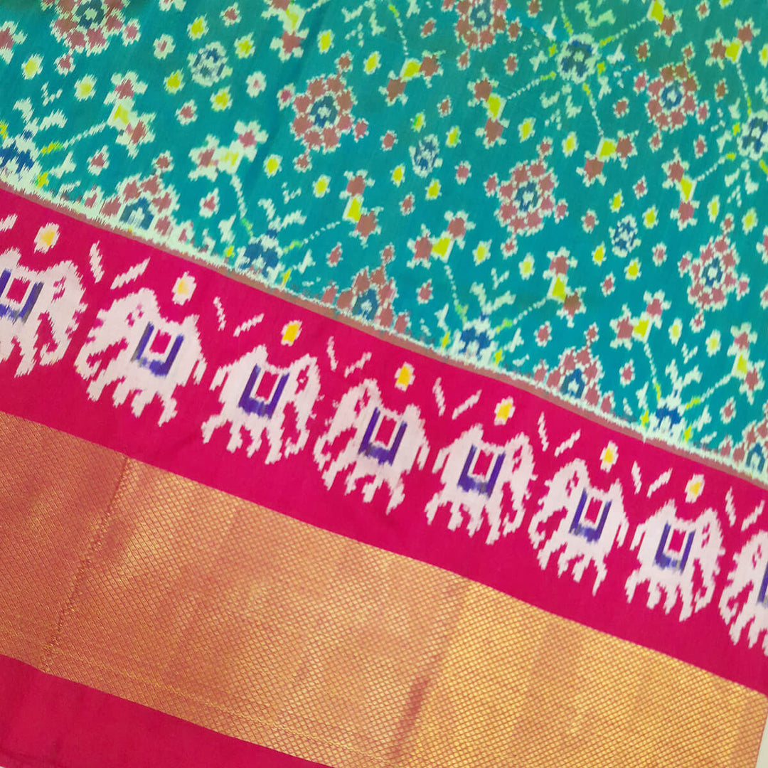 Handwoven Ikat pure silk unstitched lehenga material in teal green & pink in navratan pattern