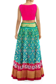 Handwoven Ikat pure silk unstitched lehenga material in teal green & pink in navratan pattern