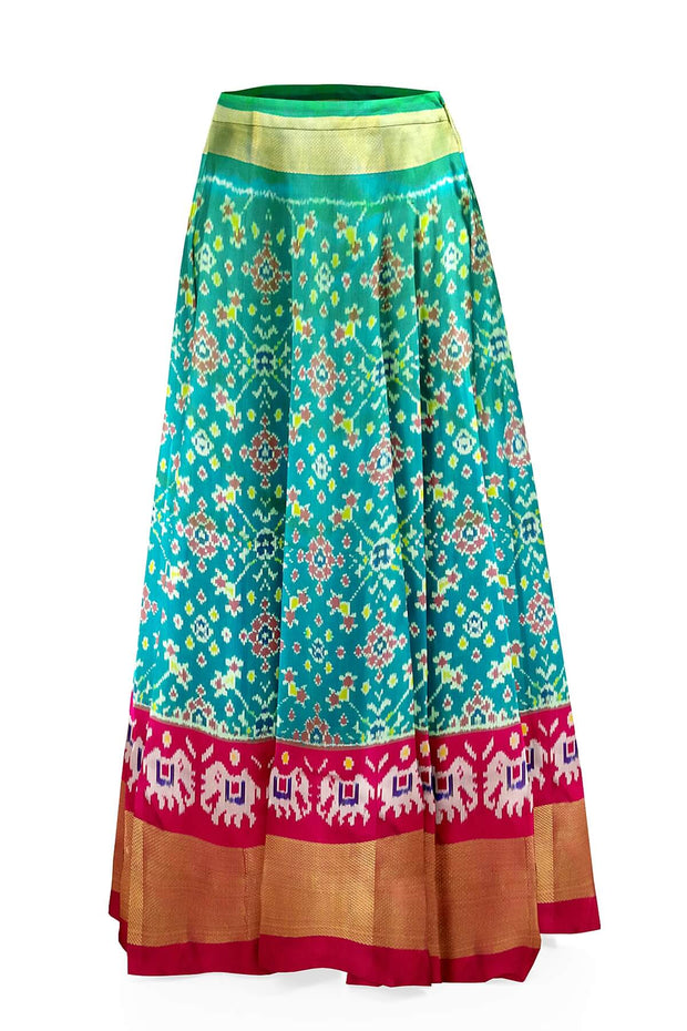 Handwoven Ikat pure silk unstitched lehenga material in teal green & pink in navratan pattern