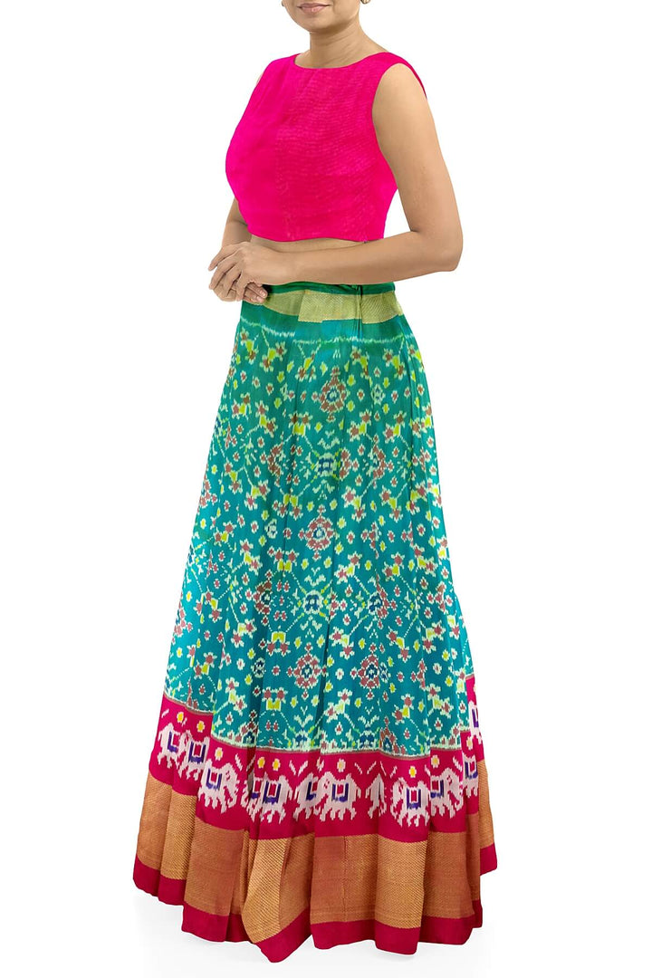 Handwoven Ikat pure silk unstitched lehenga material in teal green & pink in navratan pattern