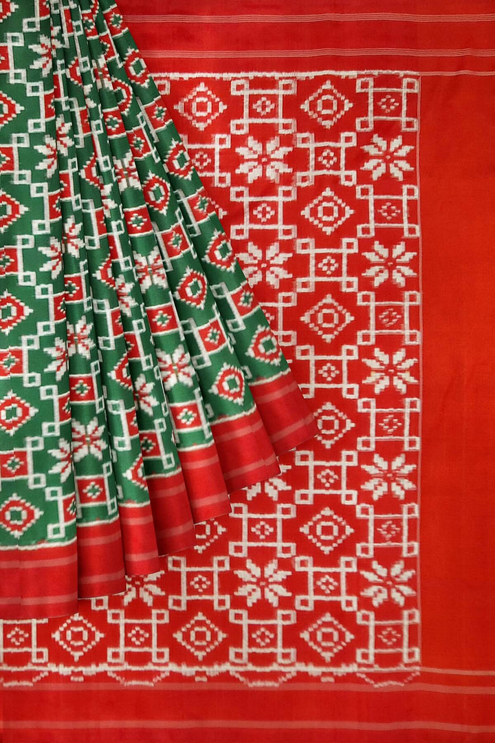 Double Ikat telia pure silk saree in green with floral motifs on the body