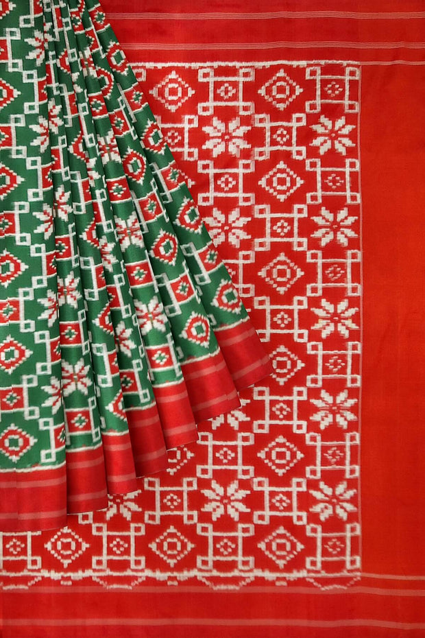 Double Ikat telia pure silk saree in green with floral motifs on the body