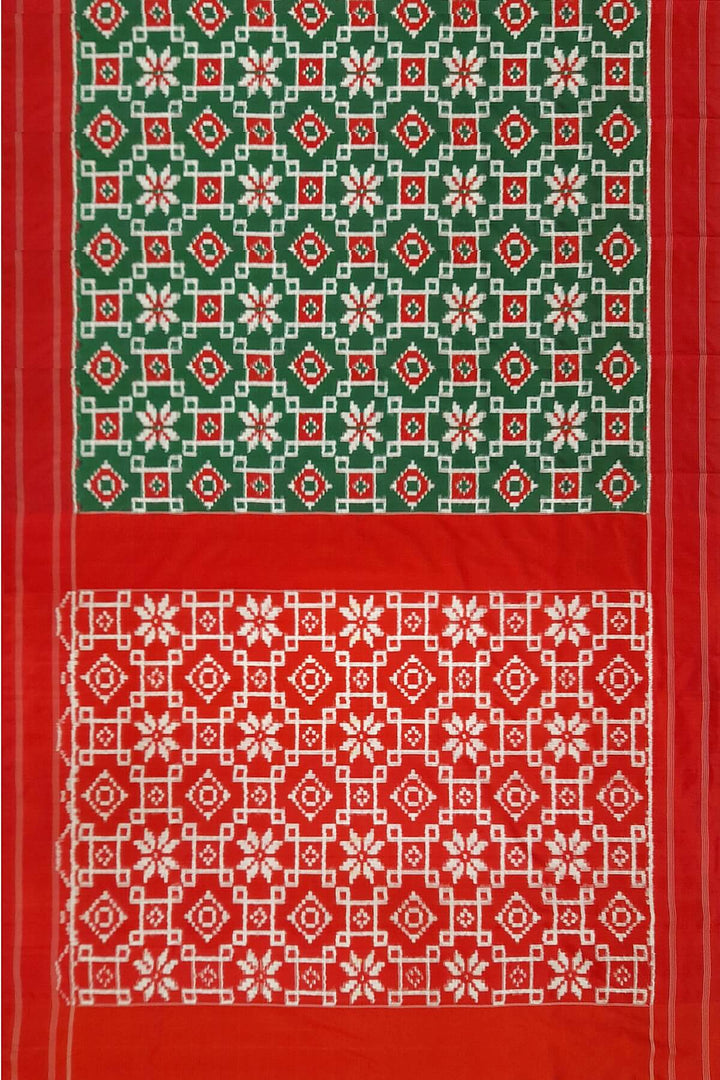 Double Ikat telia pure silk saree in green with floral motifs on the body