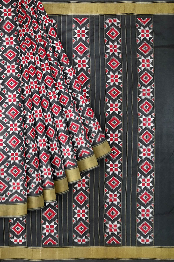 Double ikat telia pure silk saree in black, red & white in geometric pattern