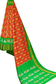 Ikat pure silk saree in orange in diamond pattern with elephant motifs in zari border & pallu.