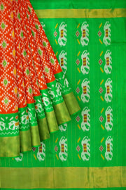 Ikat pure silk saree in orange in diamond pattern with elephant motifs in zari border & pallu.
