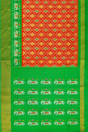 Ikat pure silk saree in orange in diamond pattern with elephant motifs in zari border & pallu.
