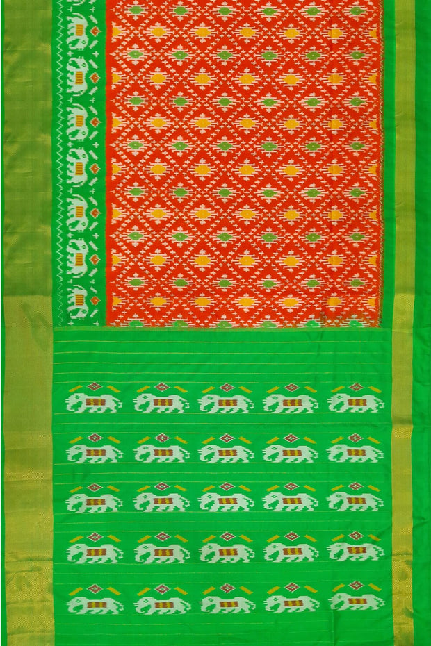 Ikat pure silk saree in orange in diamond pattern with elephant motifs in zari border & pallu.