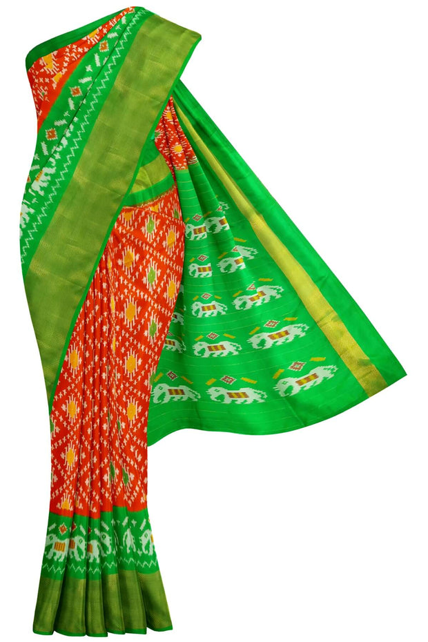 Ikat pure silk saree in orange in diamond pattern with elephant motifs in zari border & pallu.