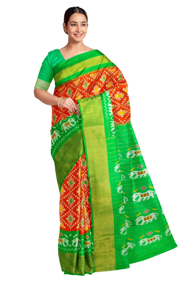 Ikat pure silk saree in orange in diamond pattern with elephant motifs in zari border & pallu.