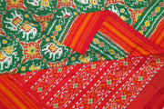 Ikat pure silk saree  in bottle green in chhabadi kunj (elephant in circle ) pattern and a striped silk border