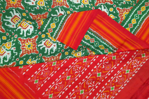Ikat pure silk saree  in bottle green in chhabadi kunj (elephant in circle ) pattern and a striped silk border