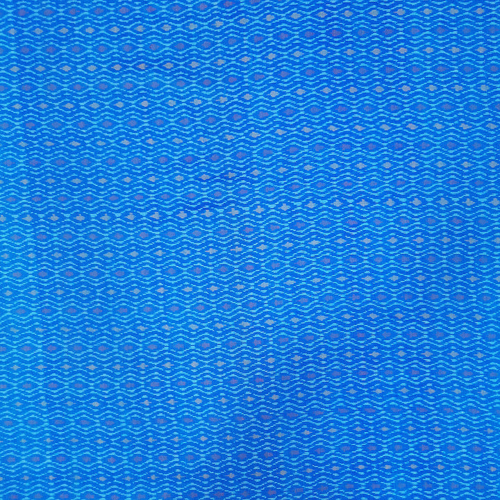 Handwoven  Ikat silk cotton fabric in medium torquoise