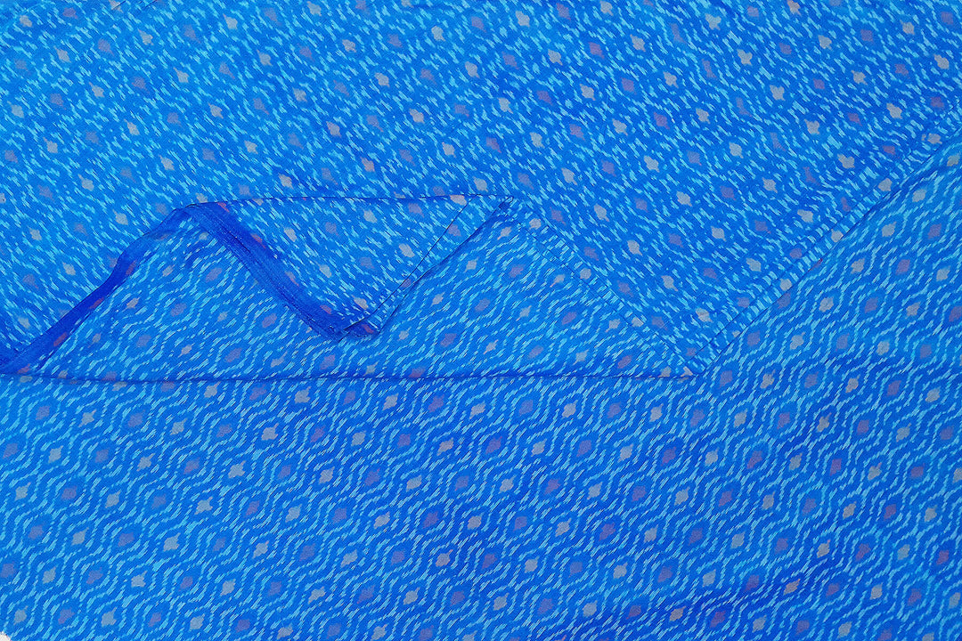 Handwoven  Ikat silk cotton fabric in medium torquoise