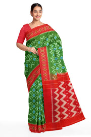 Handwoven ikat pure cotton saree in green with floral motifs