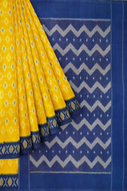 Handwoven ikat pure cotton saree in yellow .