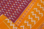 Handwoven ikat pure cotton saree in maroon with floral motifs