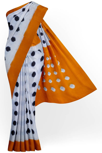Handwoven double Ikat pure cotton saree in  off white with polka dots.