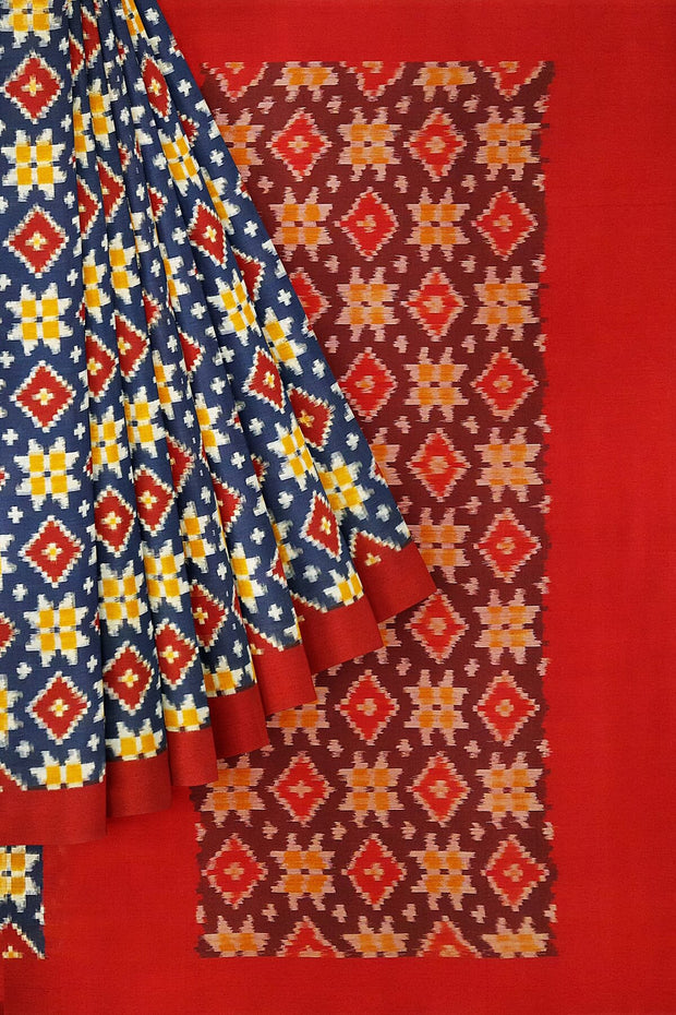 Handwoven double Ikat telia pure cotton saree in blue base with four motifs and a contrast pallu in maroon.