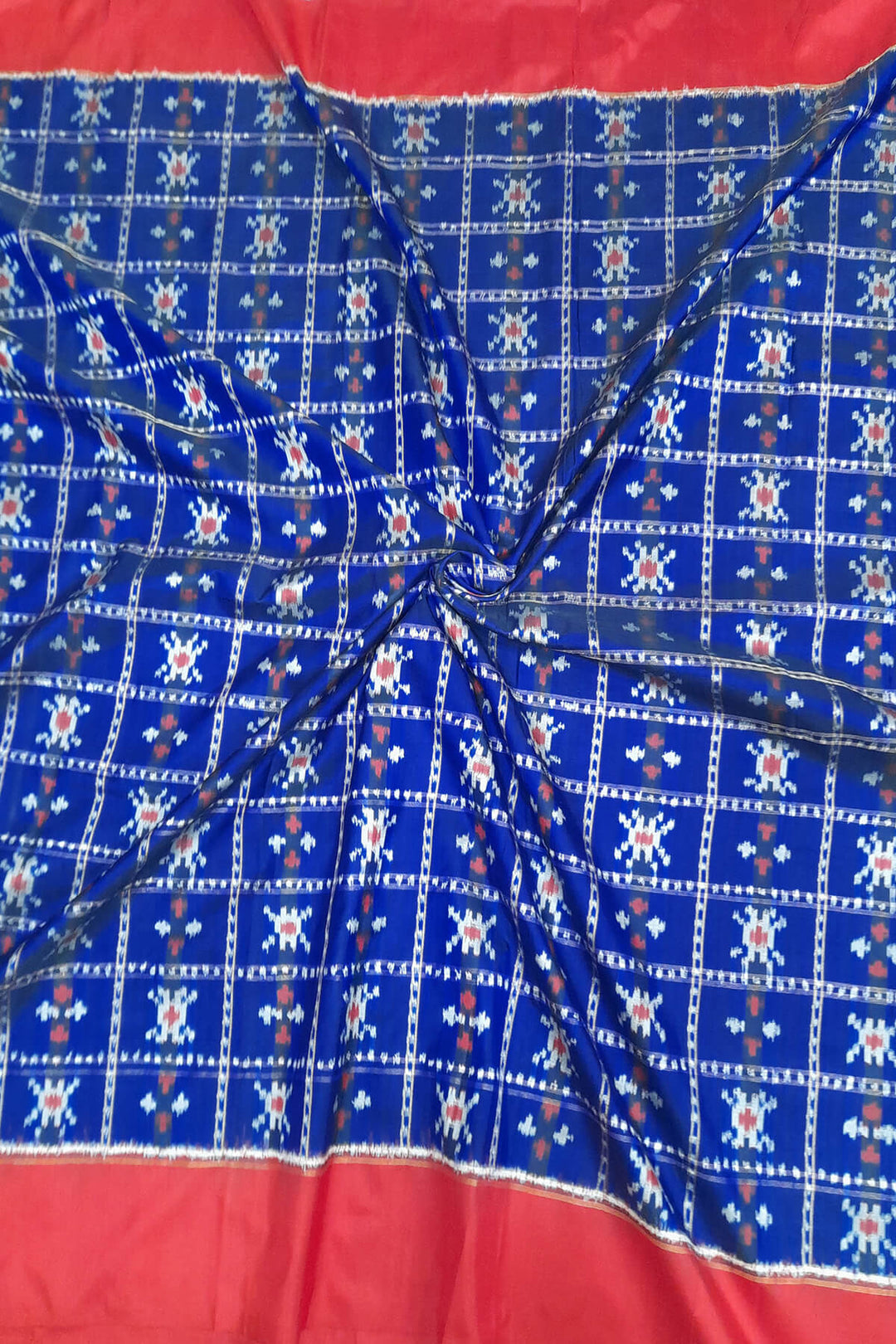 Handwoven Ikat pure silk fabric in blue with red border