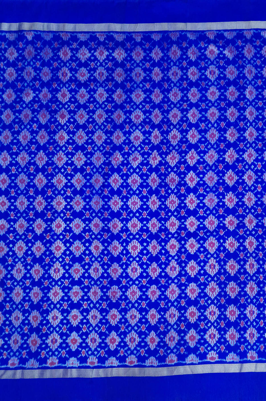 Handwoven Ikat pure silk fabric in diamond pattern in blue with border