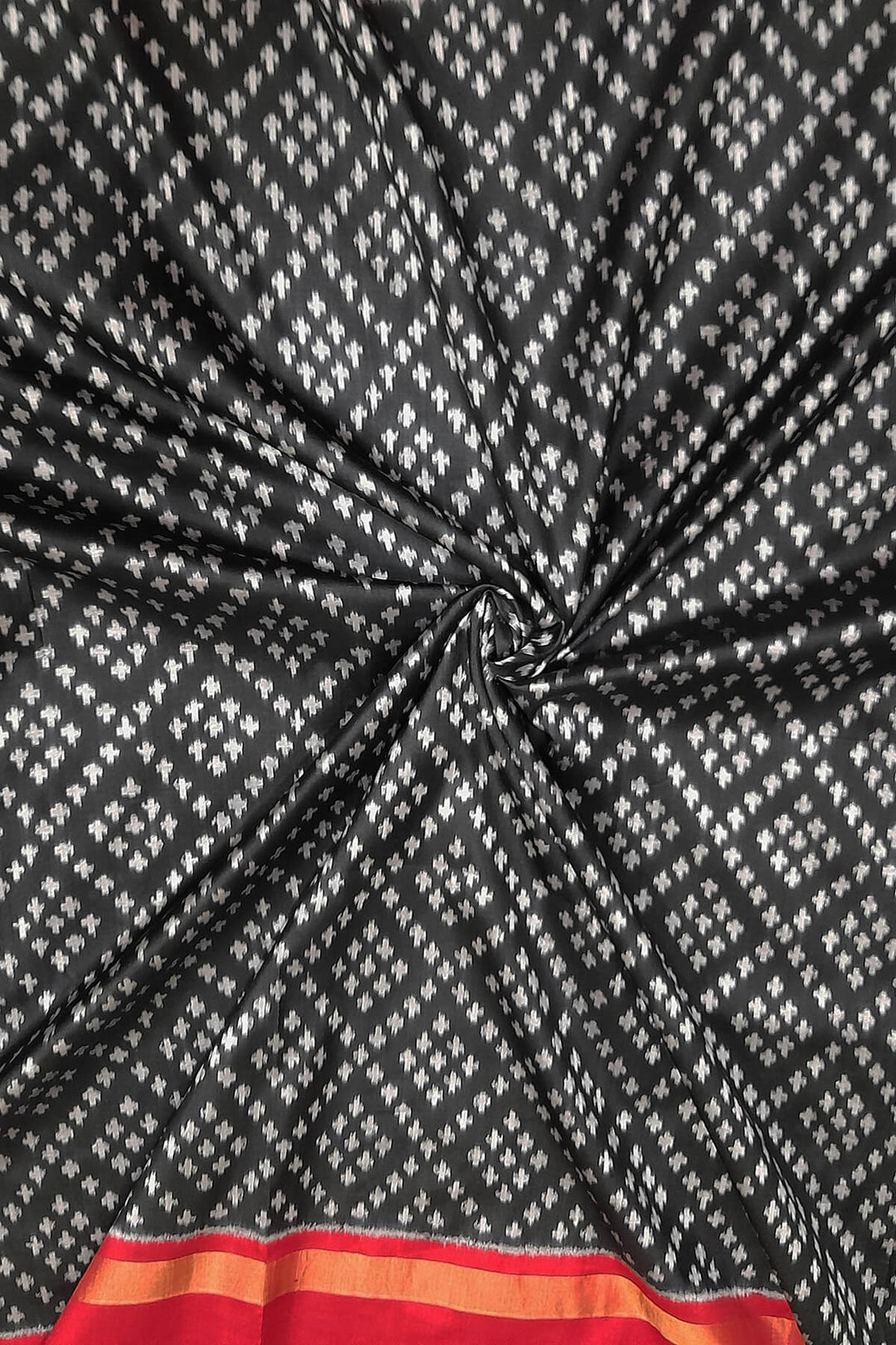 Handwoven Ikat pure silk fabric in black in geometric pattern with border