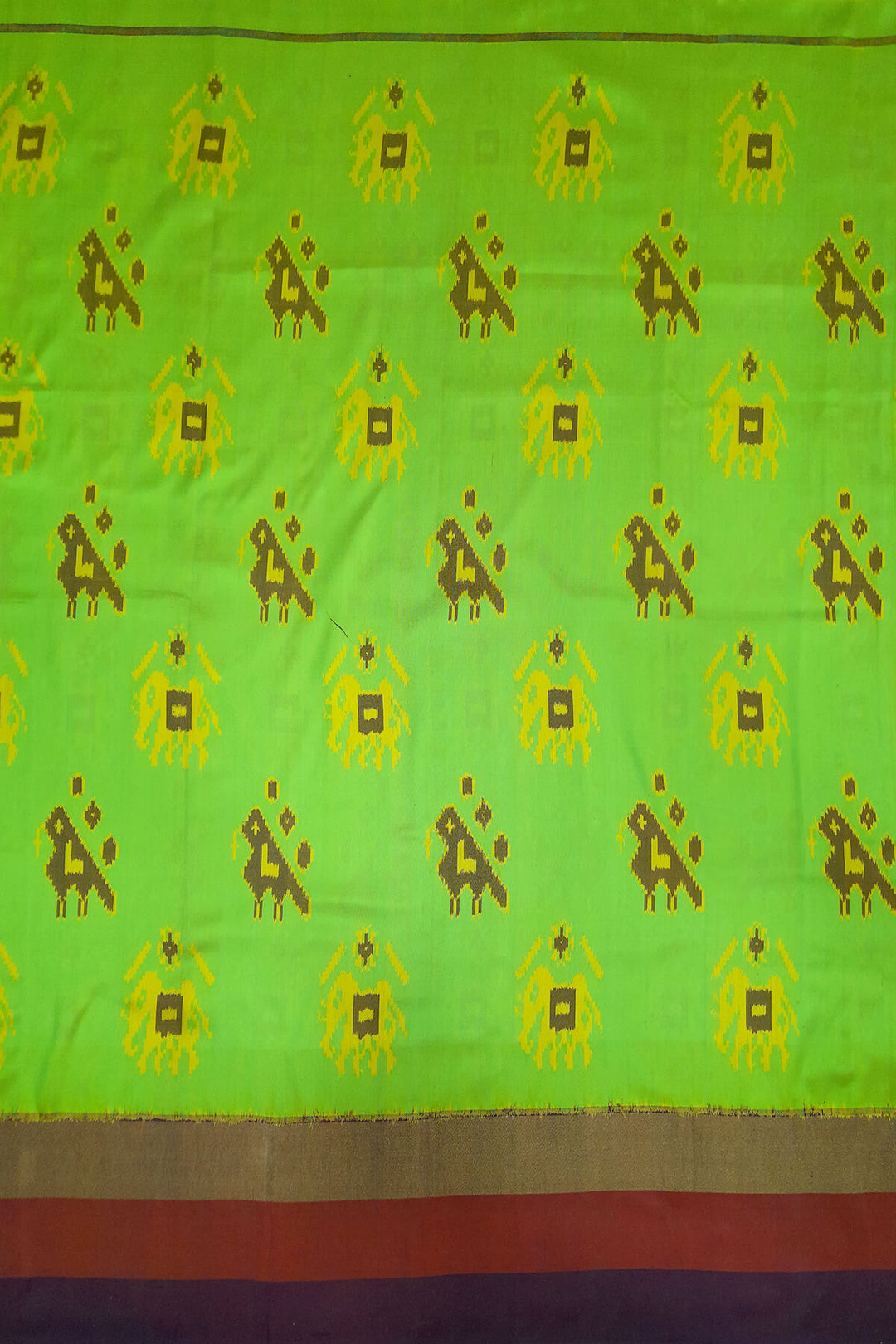 Handwoven Ikat pure silk fabric in green with elephant & bird motifs and red border