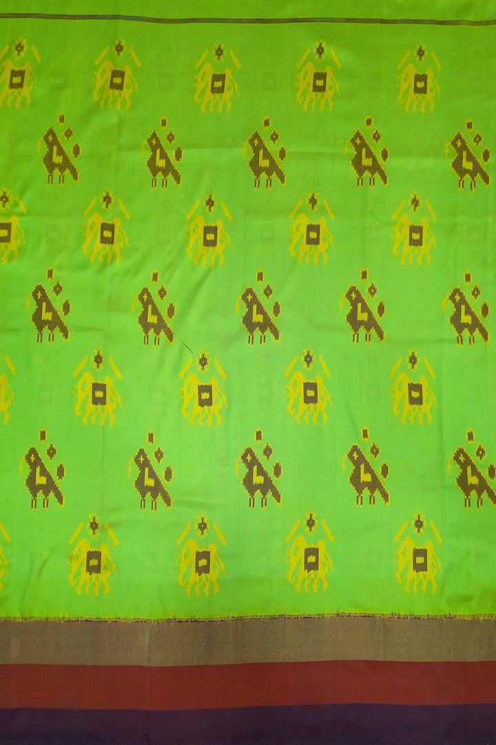 Handwoven Ikat pure silk fabric in green with elephant & bird motifs and red border