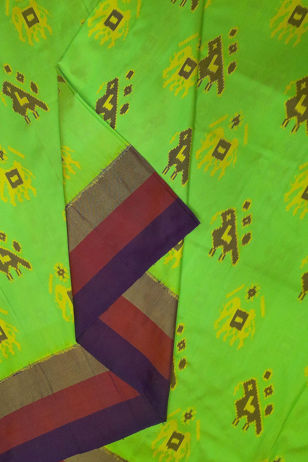 Handwoven Ikat pure silk fabric in green with elephant & bird motifs and red border