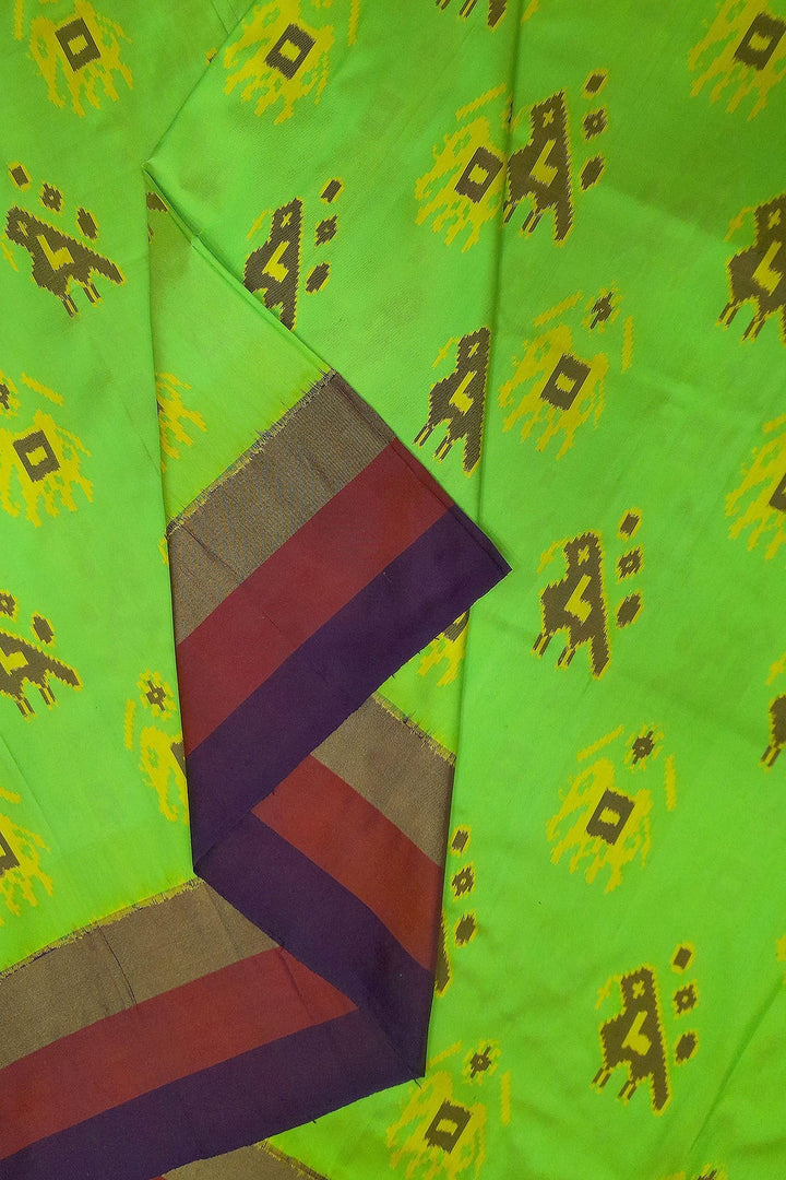 Handwoven Ikat pure silk fabric in green with elephant & bird motifs and red border