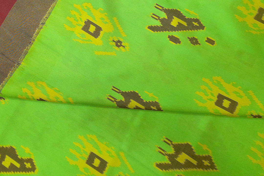Handwoven Ikat pure silk fabric in green with elephant & bird motifs and red border