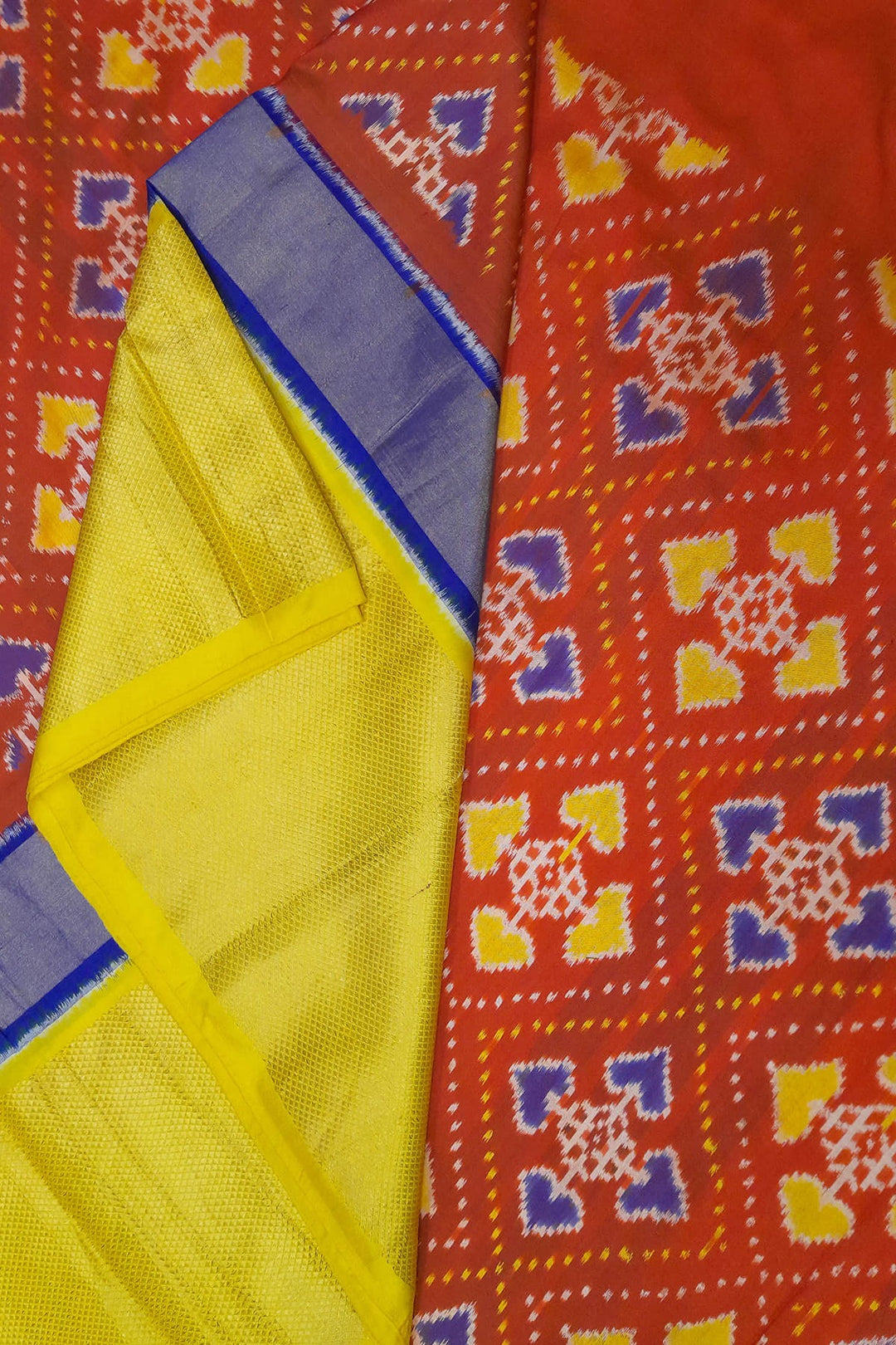 Handwoven Ikat pure silk fabric  in patola pattern in red with multicoloured border