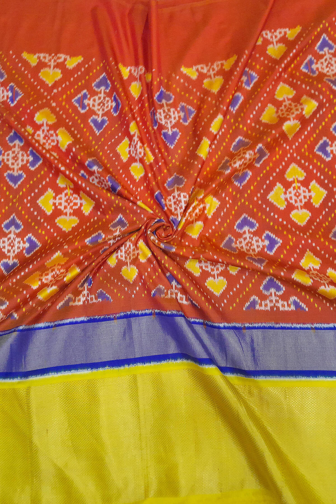 Handwoven Ikat pure silk fabric  in patola pattern in red with multicoloured border