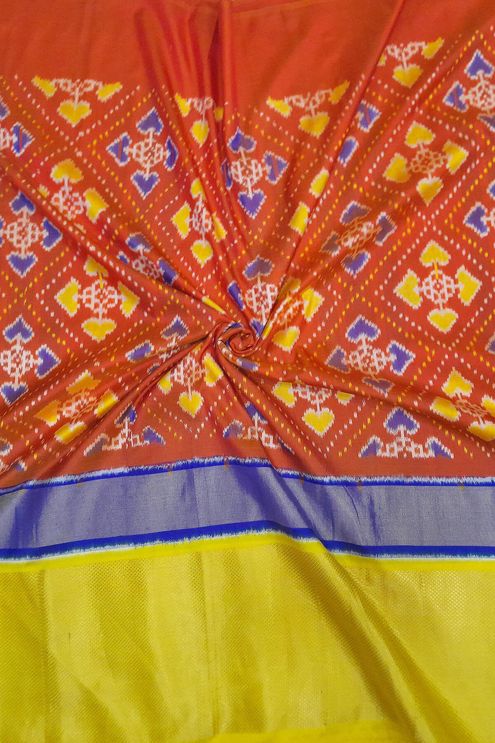Handwoven Ikat pure silk fabric  in patola pattern in red with multicoloured border