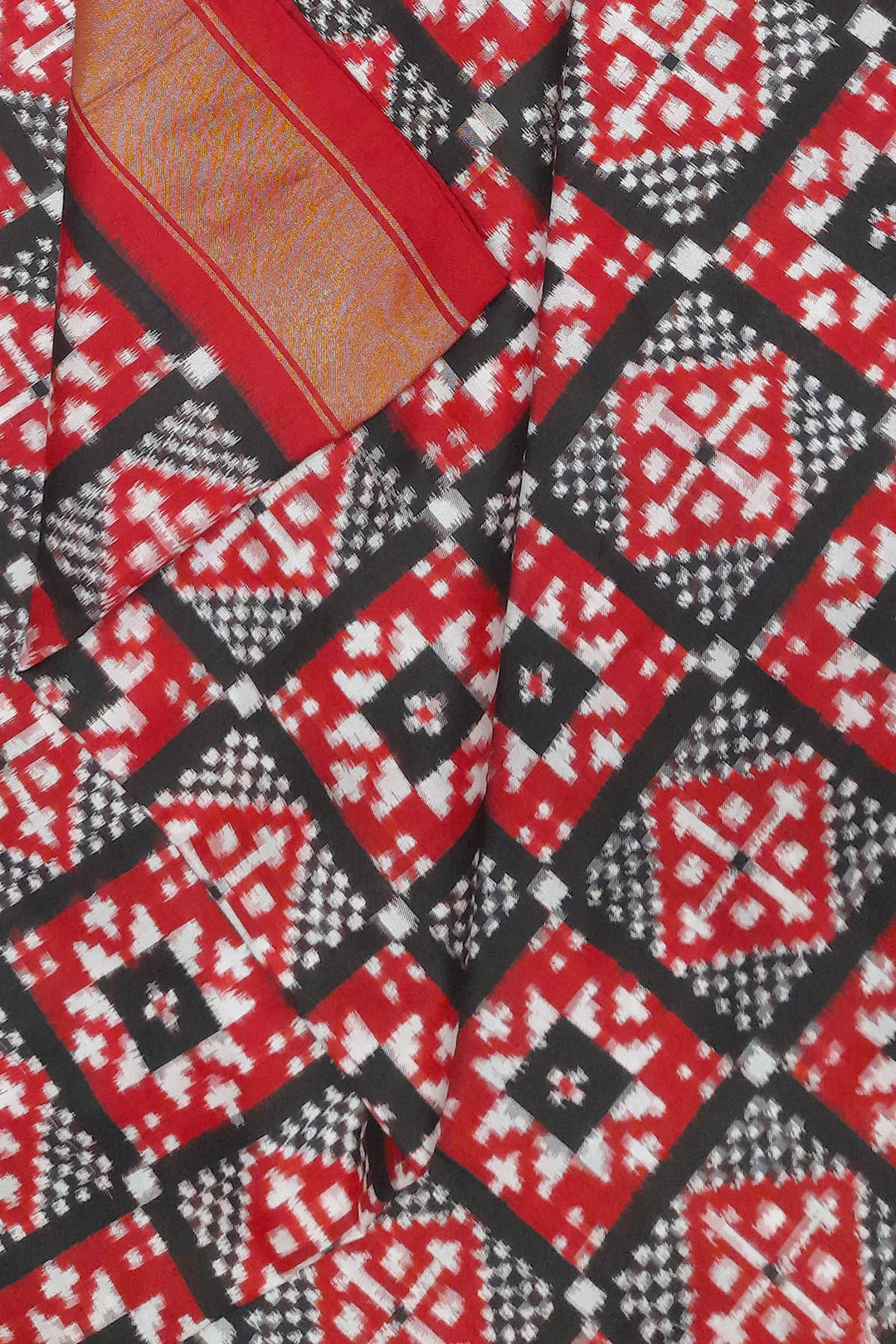 Handwoven Double Ikat pure silk fabric in geometric pattern in black checks with border