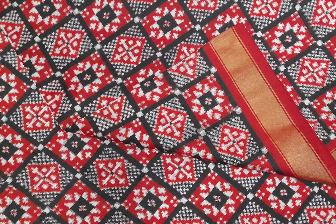 Handwoven Double Ikat pure silk fabric in geometric pattern in black checks with border